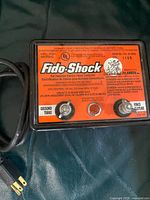 Front view showing orange label, model number, binding posts and power cord