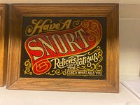 Front view of framed mirror sign showing full artwork and wood frame