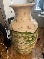 Full view of tall glazed vase showing overall shape and finish