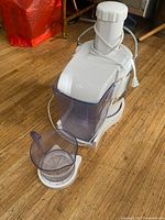 Side view of Jack LaLanne Power Juicer with pulp bin and pitcher