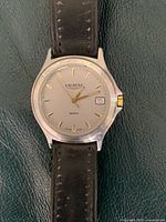 Front view showing dial, brand name, date window and overall condition