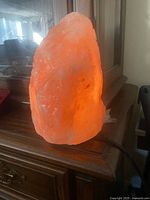 Front view of illuminated Himalayan salt lamp