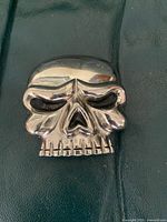 Front of skull-shaped belt buckle