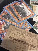 Stack of Dawson Diamond Jubilee postcards and sleeve