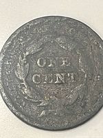 Reverse side of 1843 Braided Hair large cent showing ONE CENT within wreath