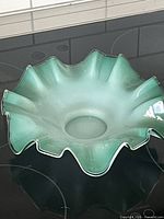 Top view showing ruffled rim and cased glass coloration