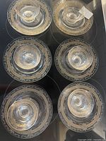 Six place settings displayed—each plate with matching bowl—showing full set