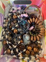 Top view of box showing assorted jewelry pieces