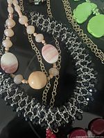 Black bead gunmetal choker, pink jasper/agates, green resin beads visible