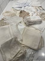 Overview of assorted linens piled on surface
