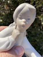 Close-up of figurine face and upper body