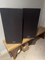 Front view of both Fisher STC-805 speakers showing grilles and Fisher badges