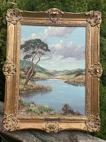 Full view of framed landscape painting