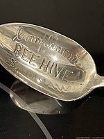 Engraved bowl reading "Compliments Beehive Saginaw"