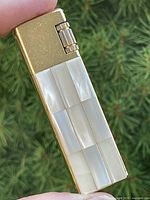 full view of lighter showing mother-of-pearl front