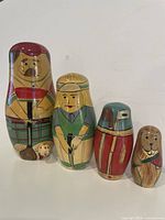 four assembled nesting dolls lined up