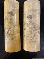 Front view of both carved panels showing etched designs