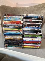 Two stacks of assorted DVD cases showing front spines