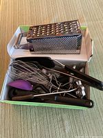 Close-up of utensils in box to show condition