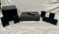 Front view of Yamaha receiver, subwoofer, centre speaker, four satellites and remote