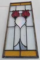 Full view of stained glass panel showing design and condition