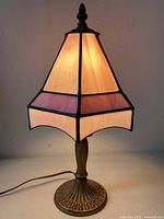 Full view lamp illuminated showing stained glass colors