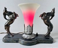 Front view lit showing gazelle figures and pink-glowing shade