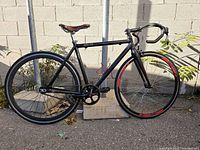 Full view of Cinelli Mystic bike leaning against post