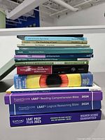 Stack of books showing visible titles and spine condition