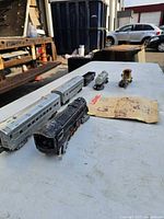 Lot overview: locomotive, two passenger cars, tank car, crane car, booklet
