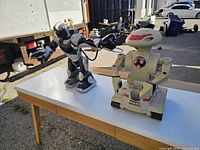 Front view of both robots on table