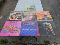 All seven LP covers laid out on table for overview