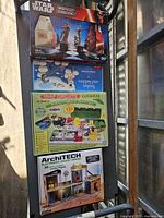 Stacked view of Star Wars Chess & Checkers, Snakes and Ladders, Snap Circuits Green, ArchiTECH Smart House boxes