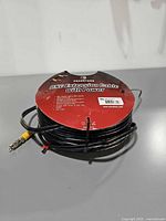 Pearstone spool showing label and cable with connectors