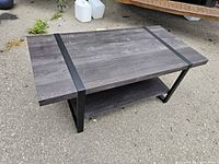 Perspective view showing top, lower shelf, and metal frame