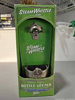 Front of retail package showing opener and cap catcher