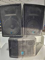 Front view of two YX15 tops stacked on LS700P subwoofer