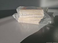 Stack of Yu-Gi-Oh! cards in plastic wrap