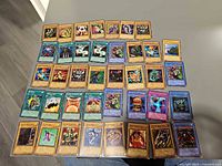 Full layout of roughly 45 Yu-Gi-Oh! cards in five rows