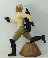 Figure in running pose with backpack and laser pistol