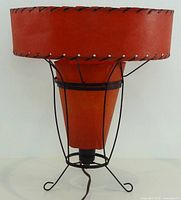 Full view of lamp showing outer drum shade and metal base