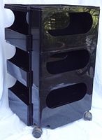 Front and right side view of black Boby trolley showing three drawers and casters