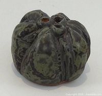 Front side view of glazed ceramic Weed Rock