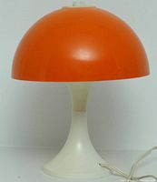 Front view of orange mushroom lamp.