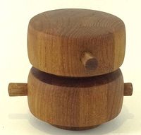 Front view of teak salt shaker & pepper mill with side handles