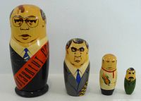 Front view of all five nesting dolls lined up by size