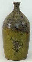 Full view of stoneware vase showing color, shape and glaze