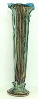 Full front view of tall glazed vase