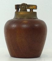 Front view showing teak body and brass lighter insert