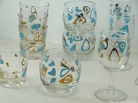Assorted lowball, roly-poly and stemmed wine glasses showing pattern